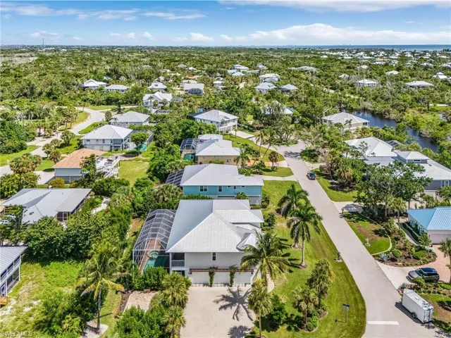 Aerial view of residential area with a large body of water
