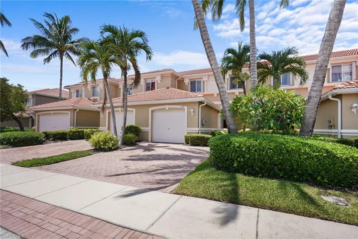 Mediterranean / spanish house with stucco siding, decorative driveway, and a tiled roof