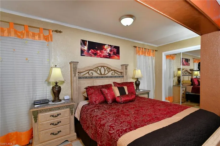 Bedroom with a closet and crown molding