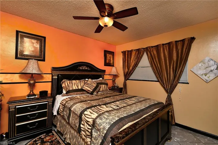 Bedroom featuring a textured ceiling and ceiling fan