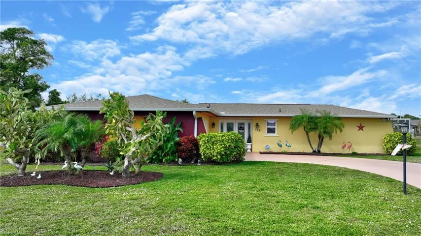 Single story home with a front yard