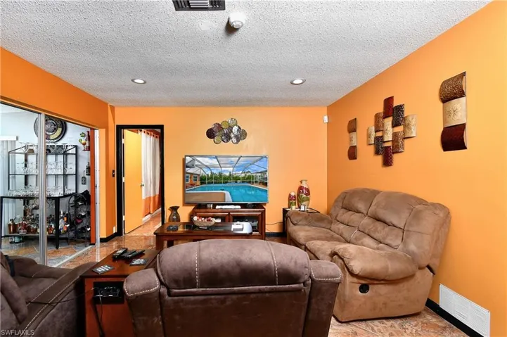 Living room featuring a textured ceiling