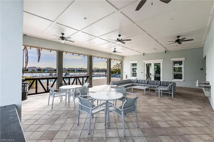 View of patio / terrace with a water view, ceiling fan, and outdoor lounge area