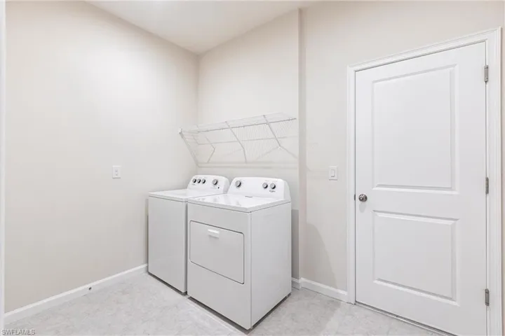 Clothes washing area featuring independent washer and dryer