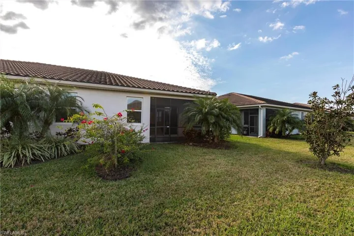 View of yard featuring a sunroom