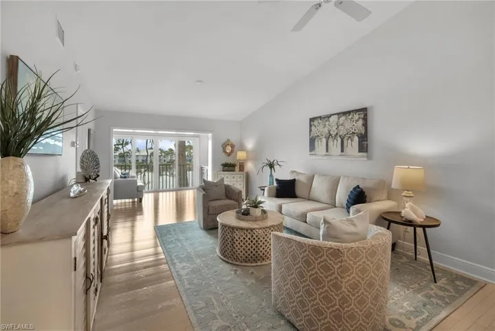 Living room featuring vaulted ceiling