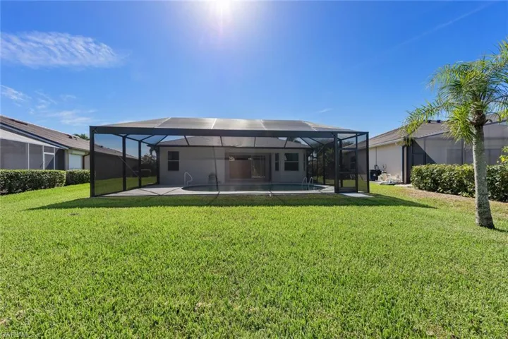 Back of property, lanai and yard