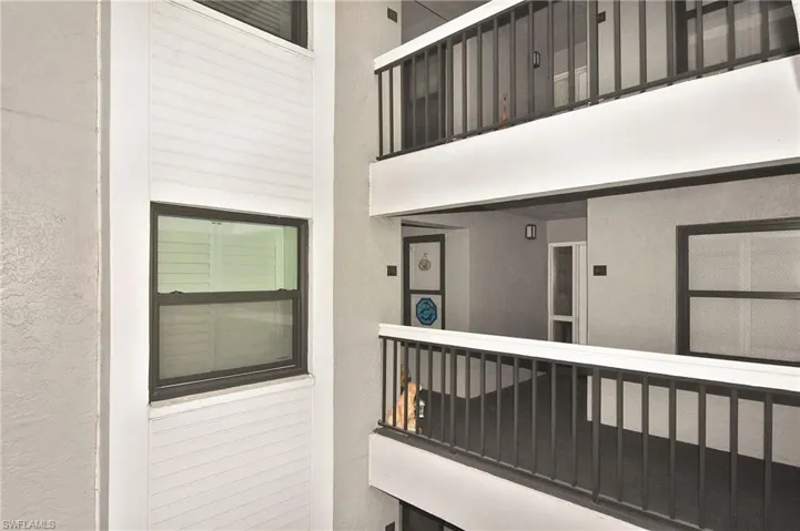 View of exterior entry with stucco siding