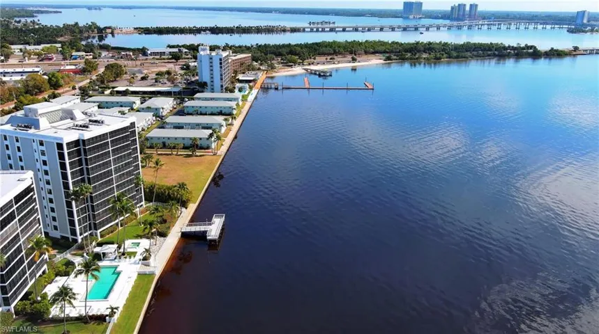 View of urban area featuring a nearby body of water and a notable bridge