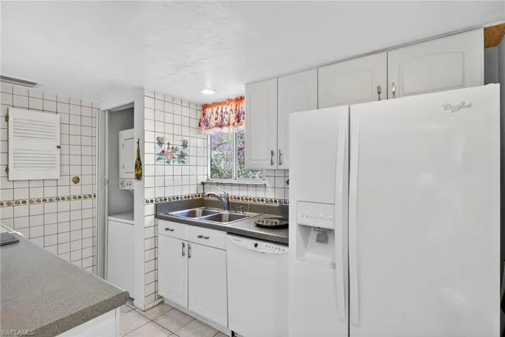 Bright, Sunny Galley-Style Kitchen with In-Unit, Stackable Washer & Dryer