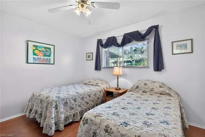 Primary Bedroom with Laminate Flooring and an In-Suite Bathroom