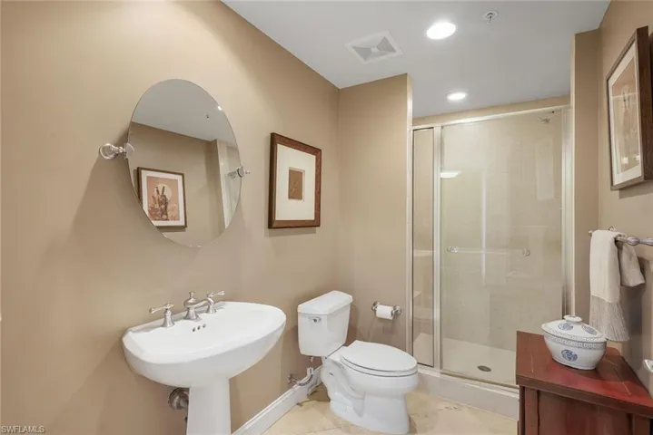 Guest bathroom features a walk-in shower.