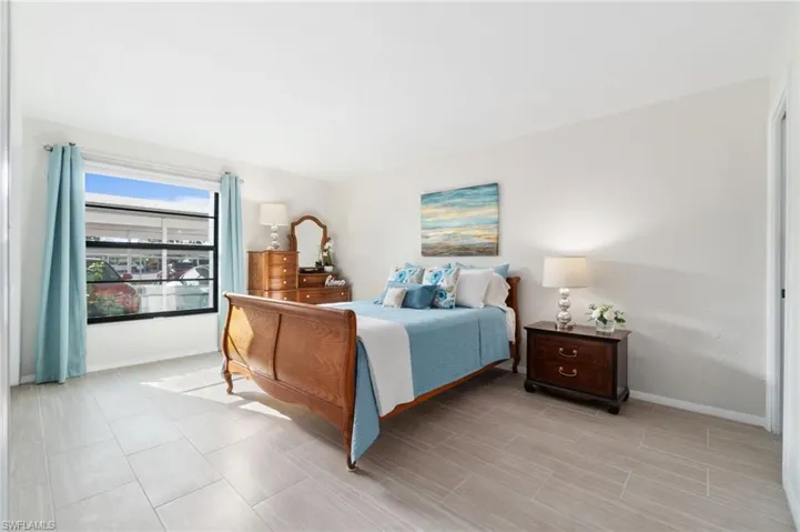 Primary bedroom w/recently tiled floors