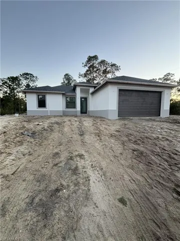 View of front of home with stucco siding