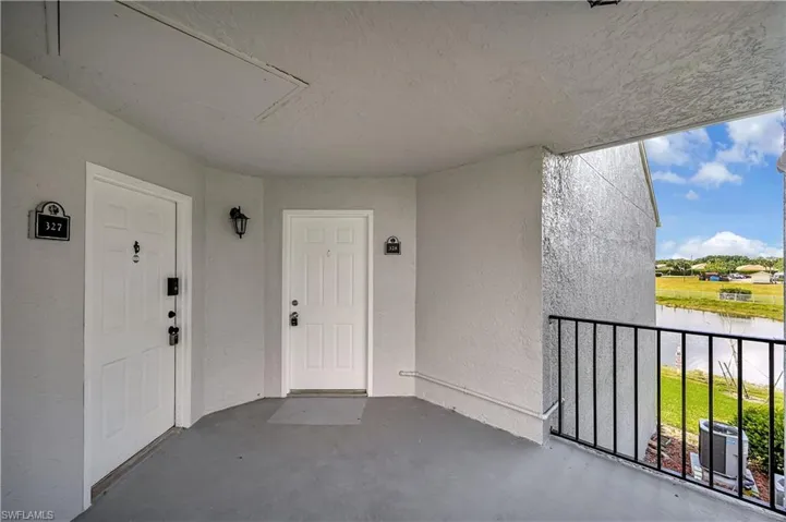 Doorway to property with a balcony