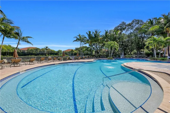 Community pool featuring a patio area