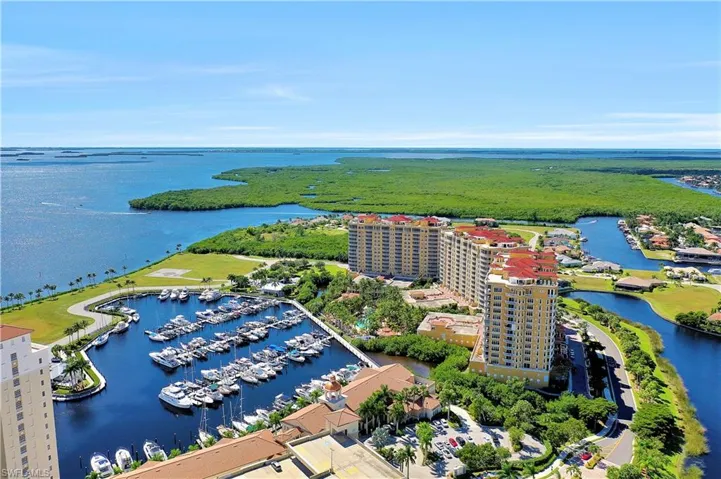 Drone / aerial view of a marina and a nearby body of water