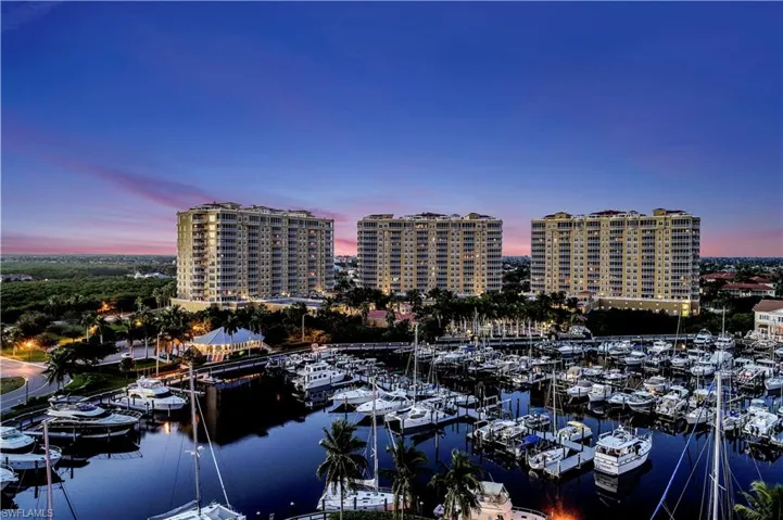 View of urban area featuring a marina and a nearby body of water