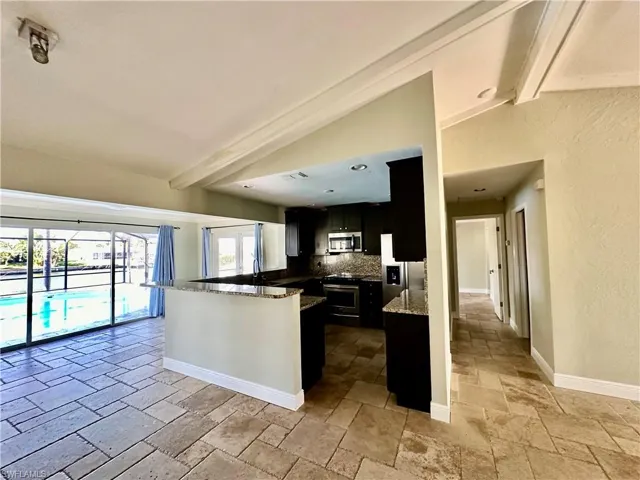 Breakfast Bar, Dining Area & Hallway to Master Bedroom
