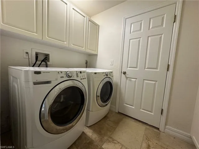 Inside Laundry w/ Front Load Washer & Dryer