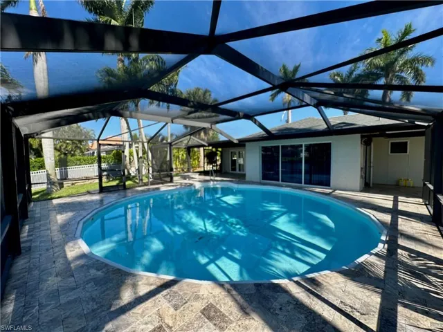 Enormous Pool Deck Surrounded by Royal Palm Tree's