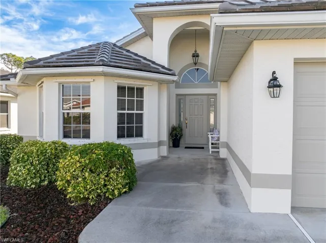 Property entrance with a garage