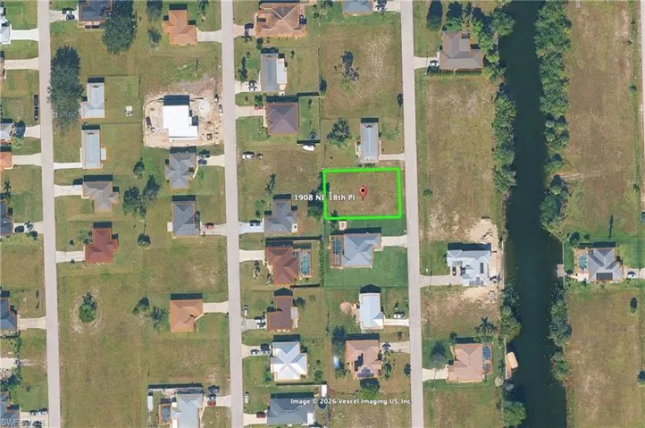 Aerial view of residential area with property boundaries highlighted