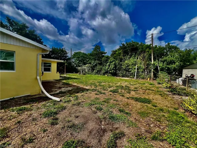 Nicely landscaped FENCED BACKYARD