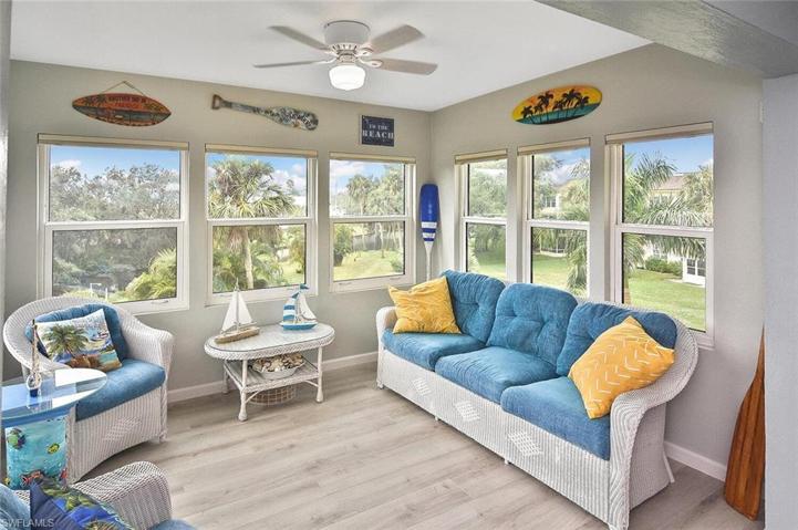 Beautiful Sunroom with Impact Glass Windows