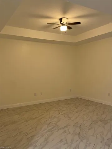 Spare room with ceiling fan