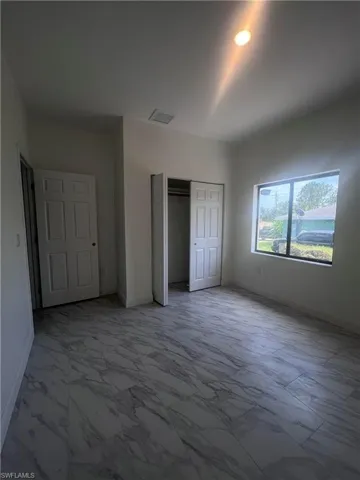 Unfurnished bedroom featuring a closet