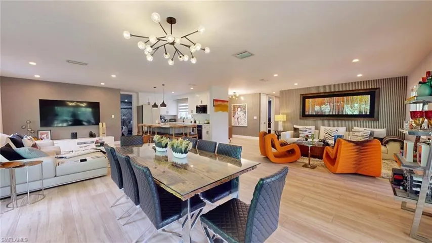 Dining room featuring recessed lighting, light wood-style floors, a chandelier, and visible vents