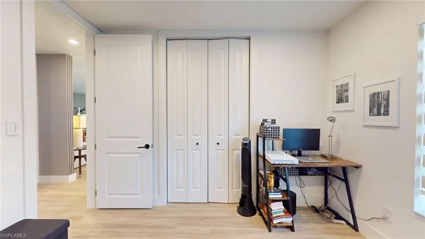 Office space featuring baseboards and light wood-style floors