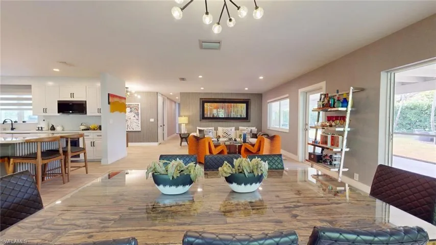 Dining area featuring light wood-style flooring, baseboards, visible vents, and recessed lighting