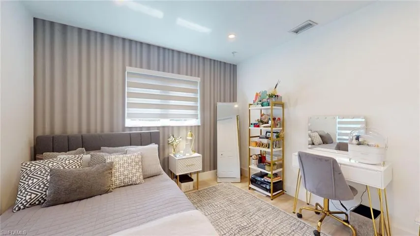 Bedroom featuring recessed lighting, visible vents, and wood finished floors