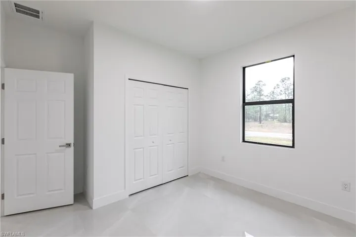 Unfurnished bedroom with a closet
