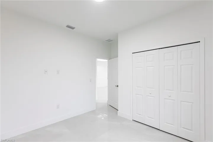 Unfurnished bedroom with a closet
