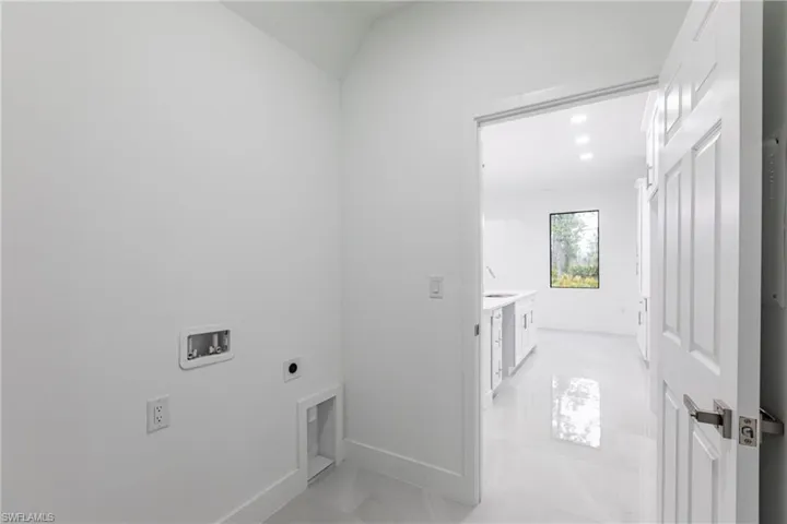 Laundry room with washer hookup and hookup for an electric dryer