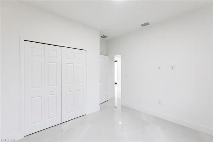 Unfurnished bedroom with a closet