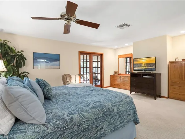 Master Bedroom w/ french door access to back screened porch