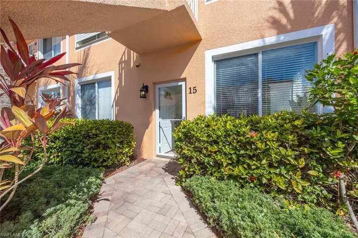 Doorway to property with stucco siding