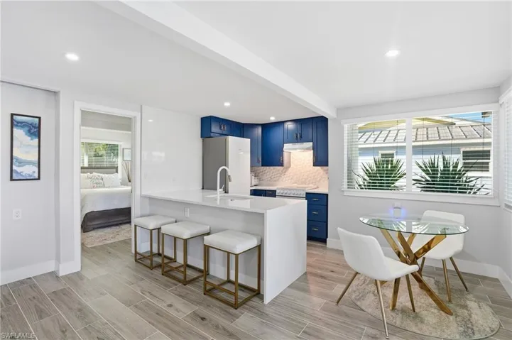 Bosch kitchen features a full quartz accent wall and breakfast bar - Virtually Edited Image