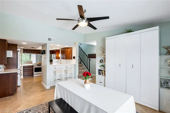 Dining room featuring a ceiling fan and light tile patterned floors