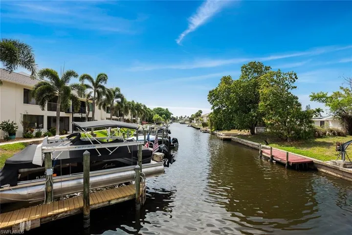 Dock area featuring a water view and boat lift