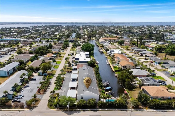 Aerial perspective of suburban area with a nearby body of water