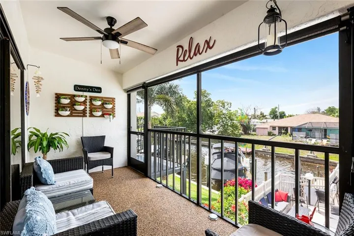 Balcony with ceiling fan and a water view