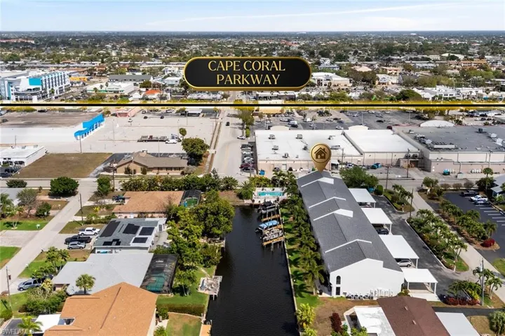Aerial perspective of suburban area with a nearby body of water