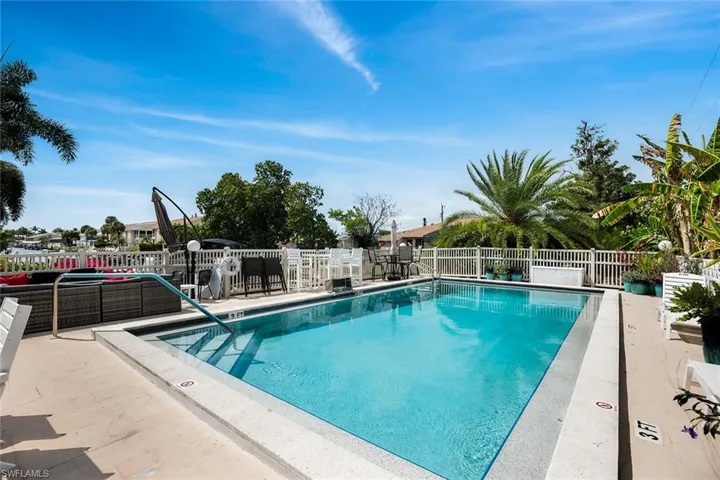 Community pool featuring a patio