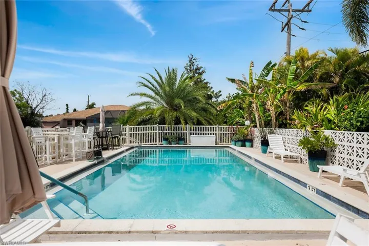 Community pool with a patio