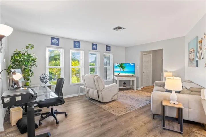 Family room with large windows and plenty of natural light.